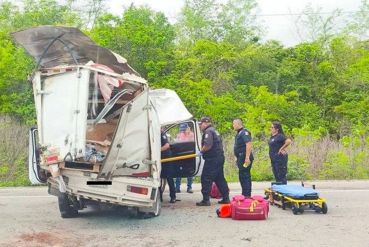 Emergency responders at the scene of a pickup truck rollover on the Merida-Cancun highway