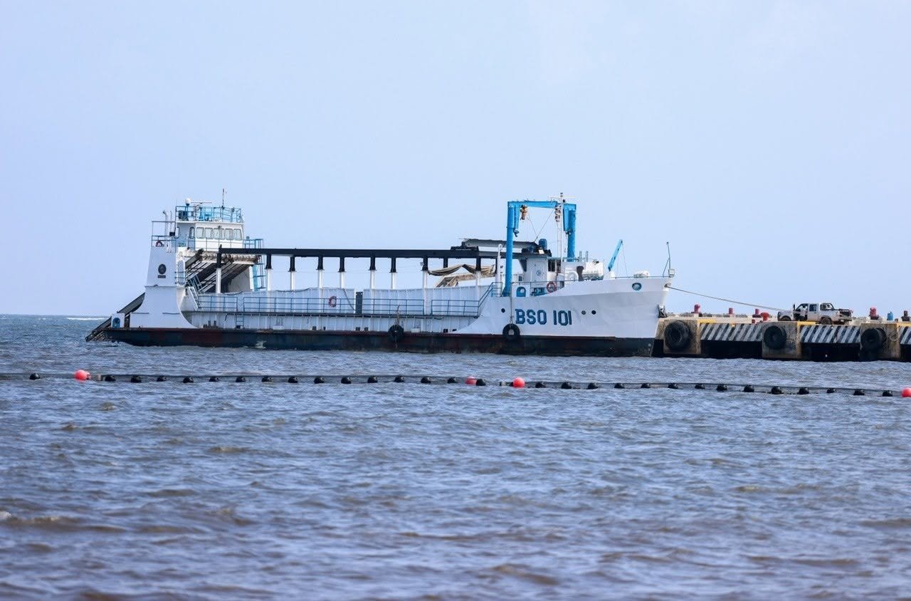 Workers installing anti-sargassum barriers along the coast of Quintana Roo