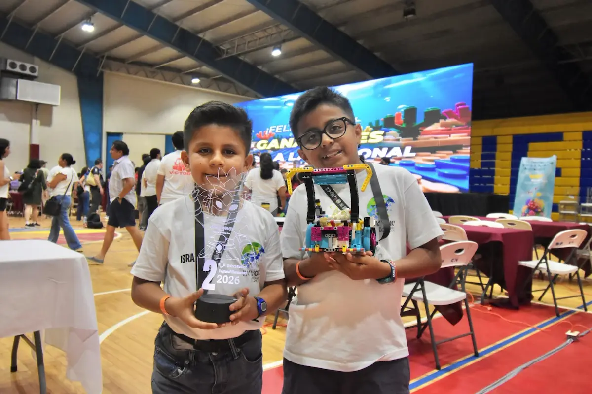 Students with robots at the World Robot Olympiad regional phase in Cancun