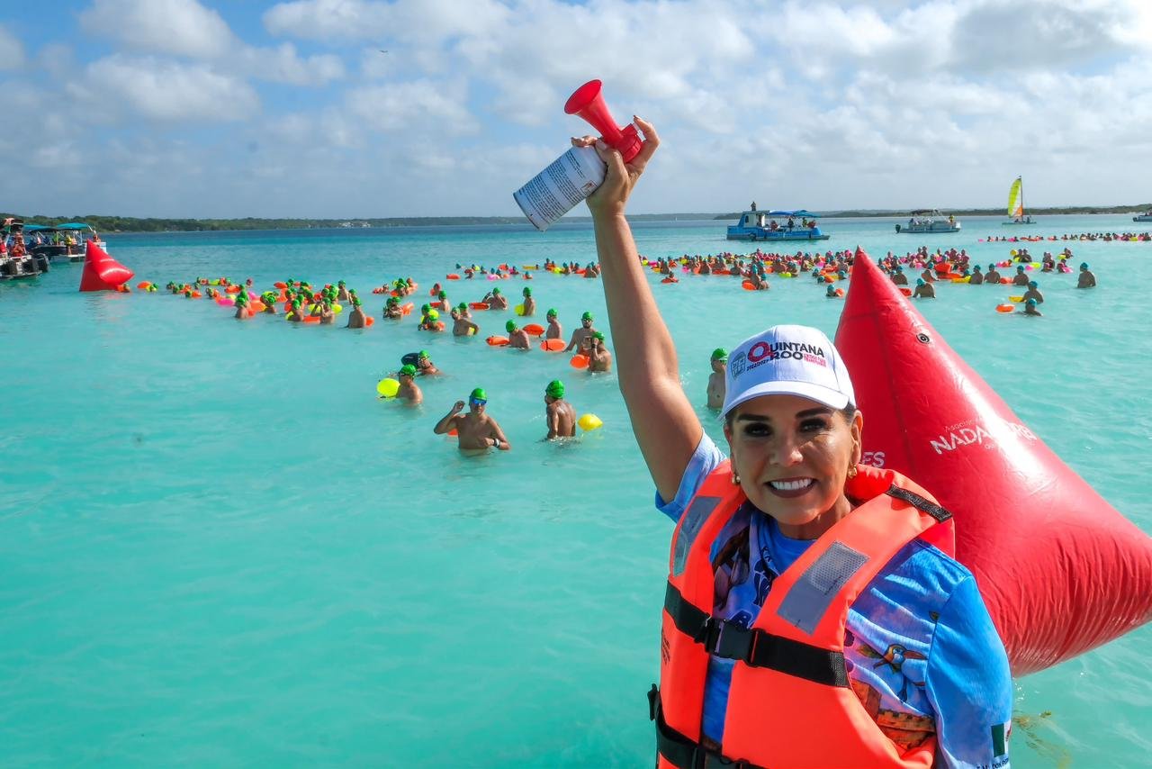 Swimmers competing in the Bacalar Open Water Marathon at the Laguna de los Siete Colores