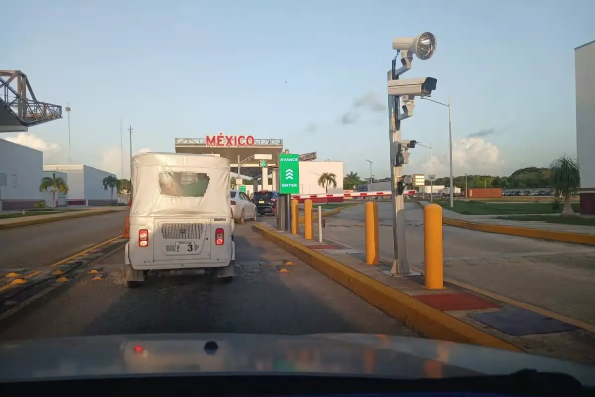 Long line of vehicles at the Belize Free Zone border crossing during a temporary closure