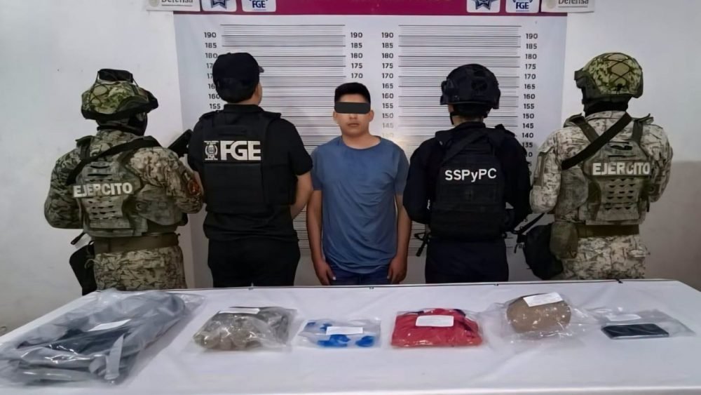 Police officers stand next to evidence bags containing suspected narcotics seized during an operation in Tulum.