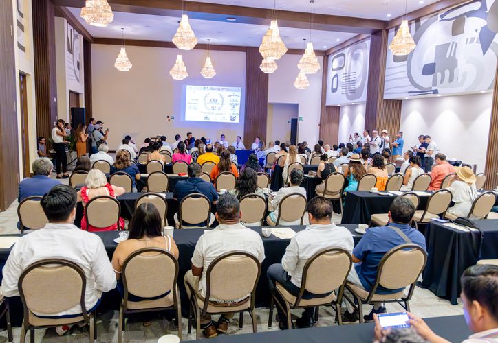 Officials and business representatives at a tourism meeting in Tulum