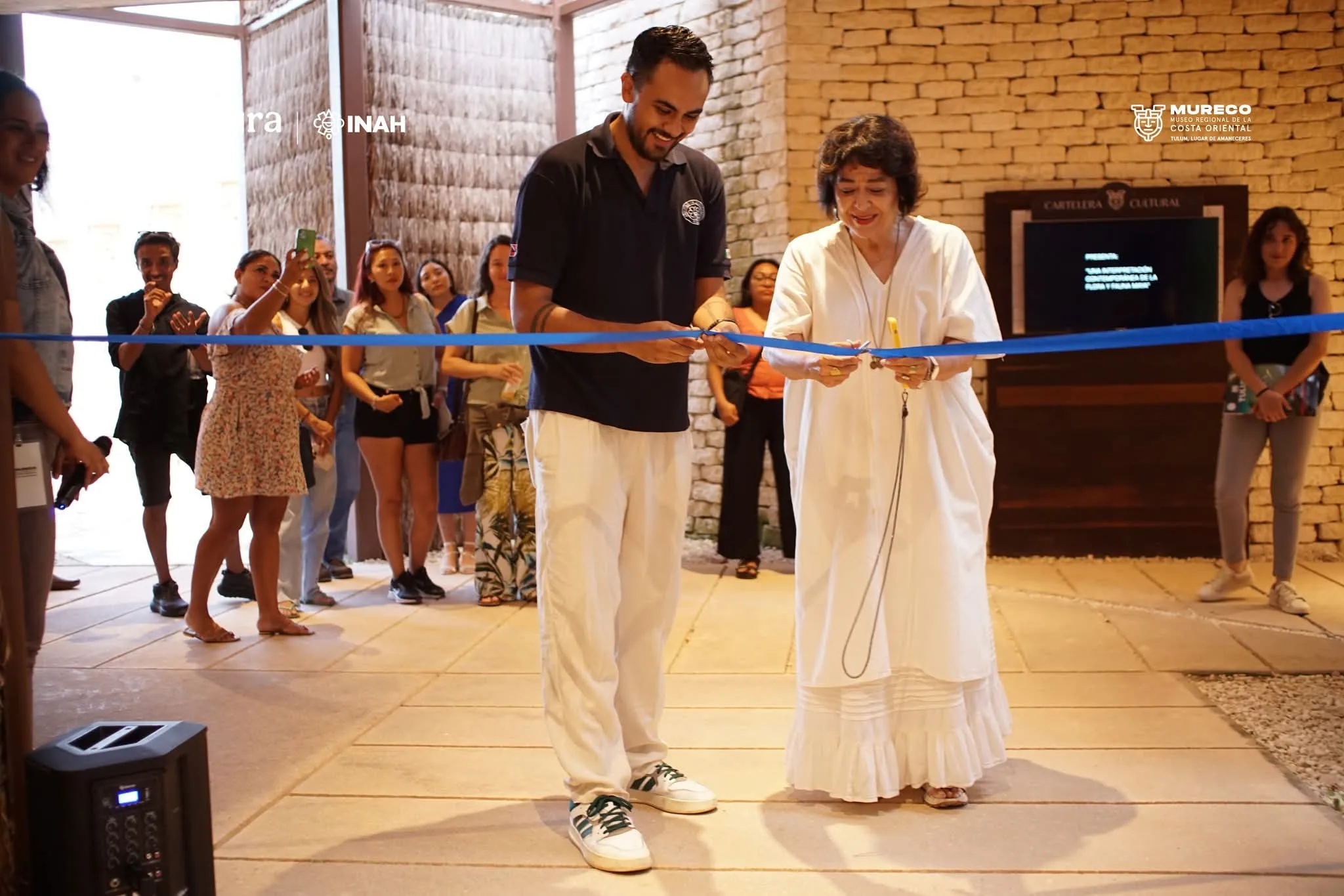 Visitors viewing an underwater archaeology exhibition at the Museo Regional de la Costa Oriental in Tulum