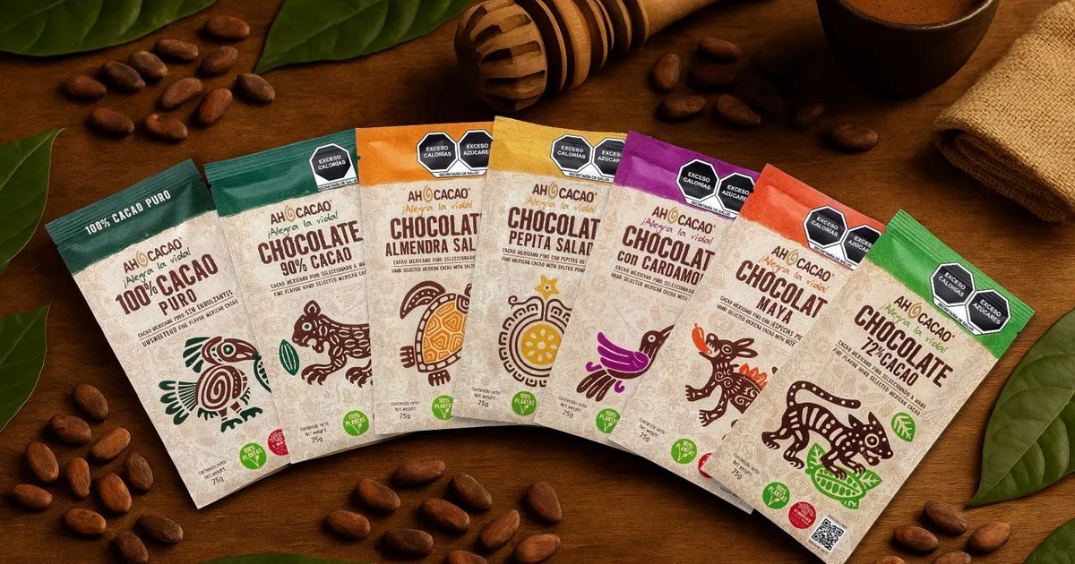 Ah Cacao artisan chocolate bars and cacao beans arranged on a wooden table