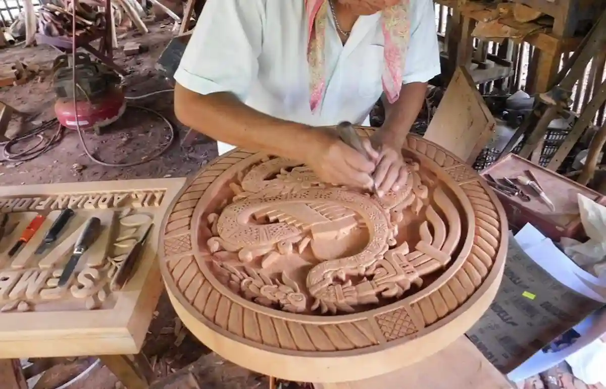 Wooden artisan pieces displayed at the municipal palace in Chetumal