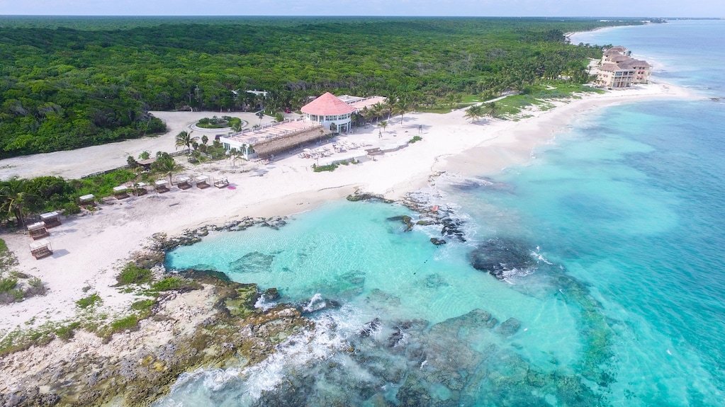 Crystal clear turquoise water at Caleta Tankah, a natural pool in Tulum, Quintana Roo
