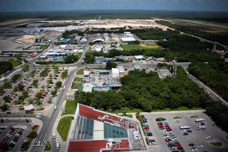 Cancun International Airport terminal with security personnel