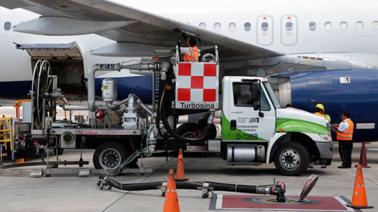 Cancun International Airport tarmac with airplanes, illustrating the impact of rising jet fuel prices on airfares to Cancun