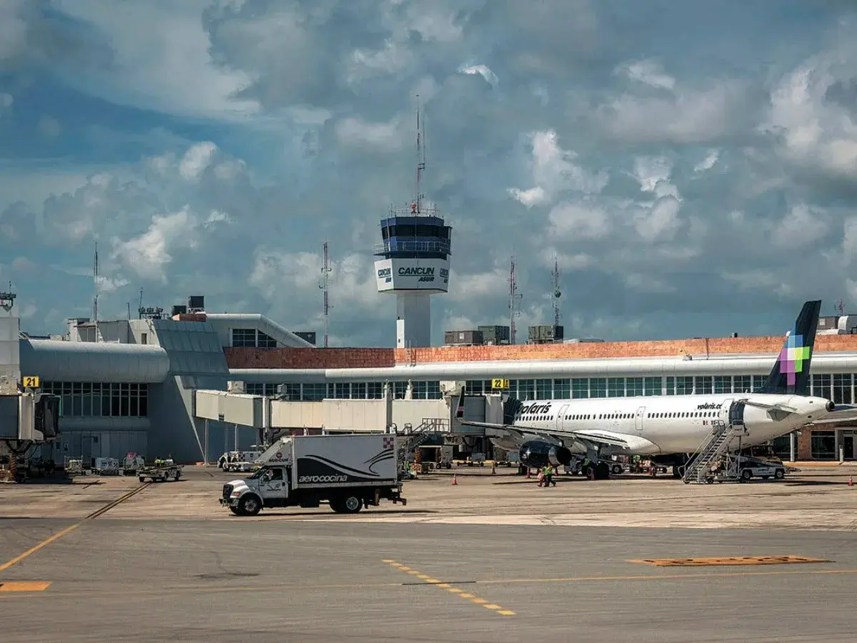 Cancun International Airport terminal with parked airplanes