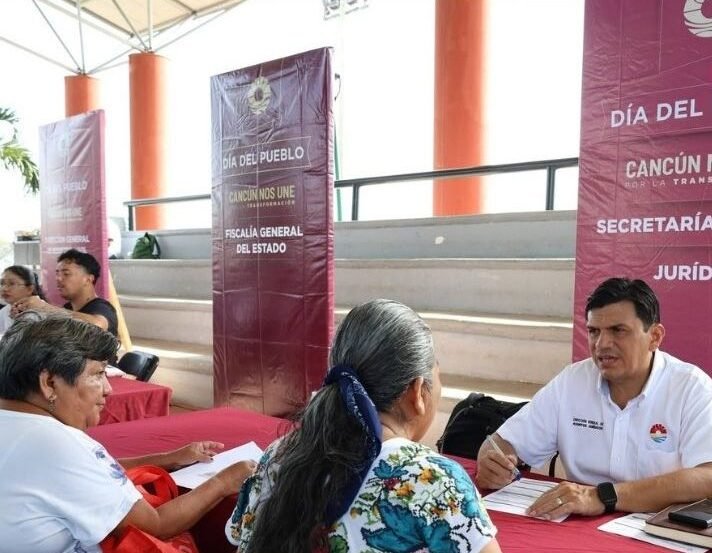 People gathered at a municipal event in Cancun offering services and discounts
