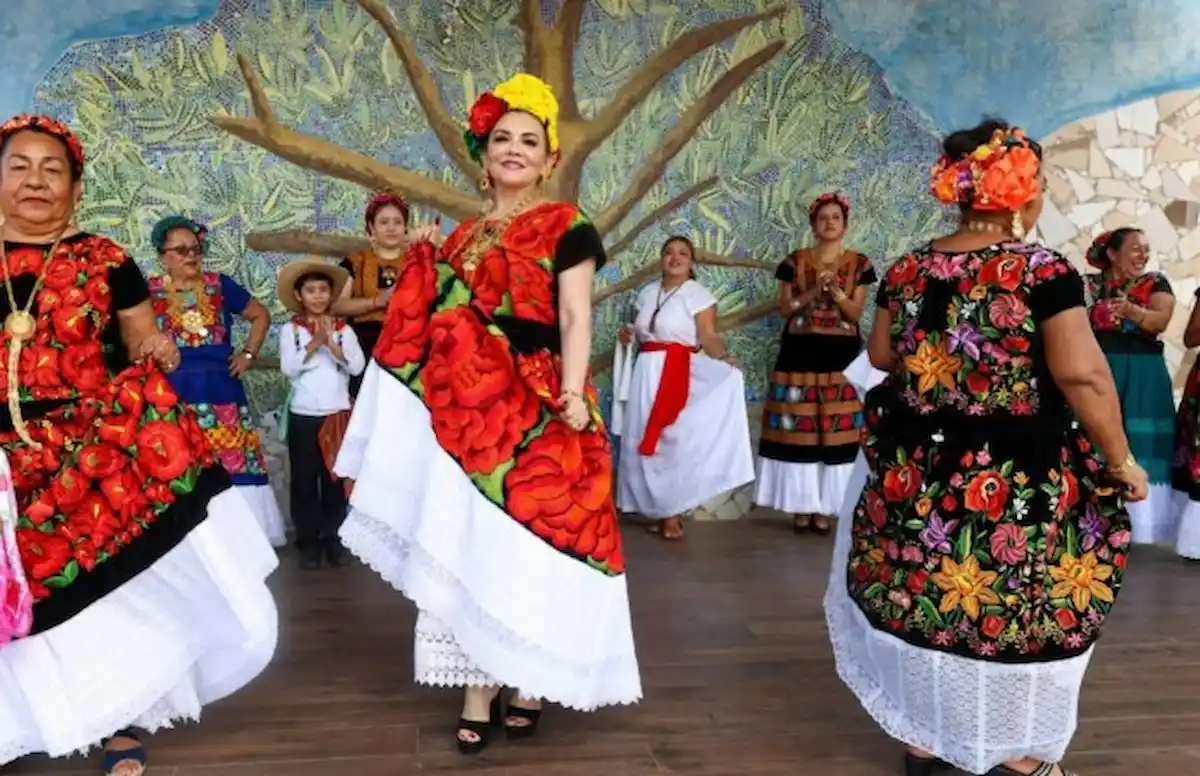 People at a festival in Cancún with stalls and decorations