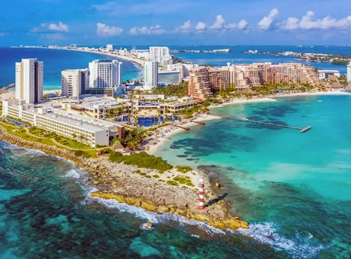 Aerial view of Cancun's hotel zone with palm trees along Boulevard Kukulkan