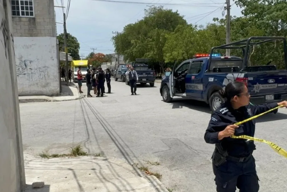 Police and paramedics at a park in Cancun after a shooting