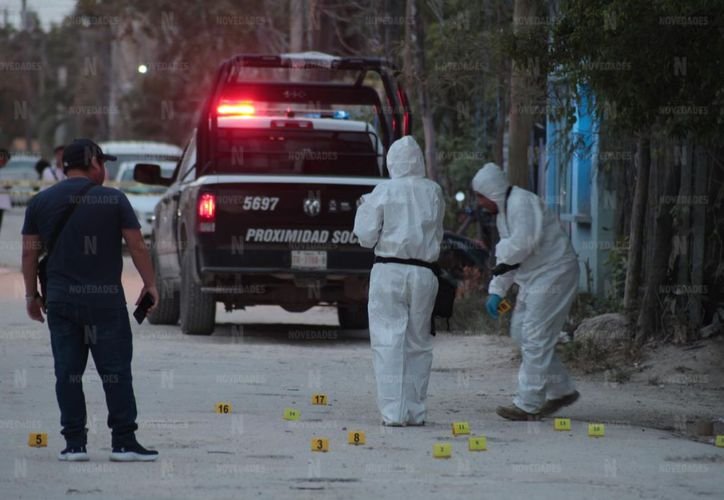 Police tape cordoning off a crime scene in a residential street in Cancun