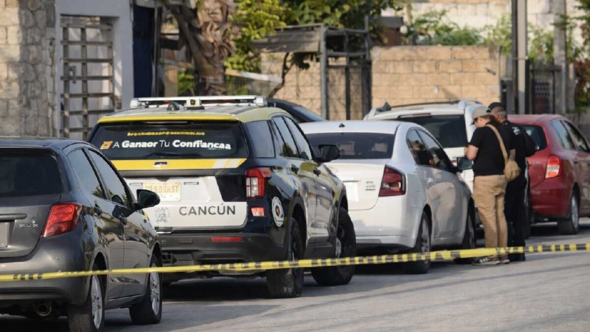 Police tape cordoning off a residential area in Cancun after a fatal shooting