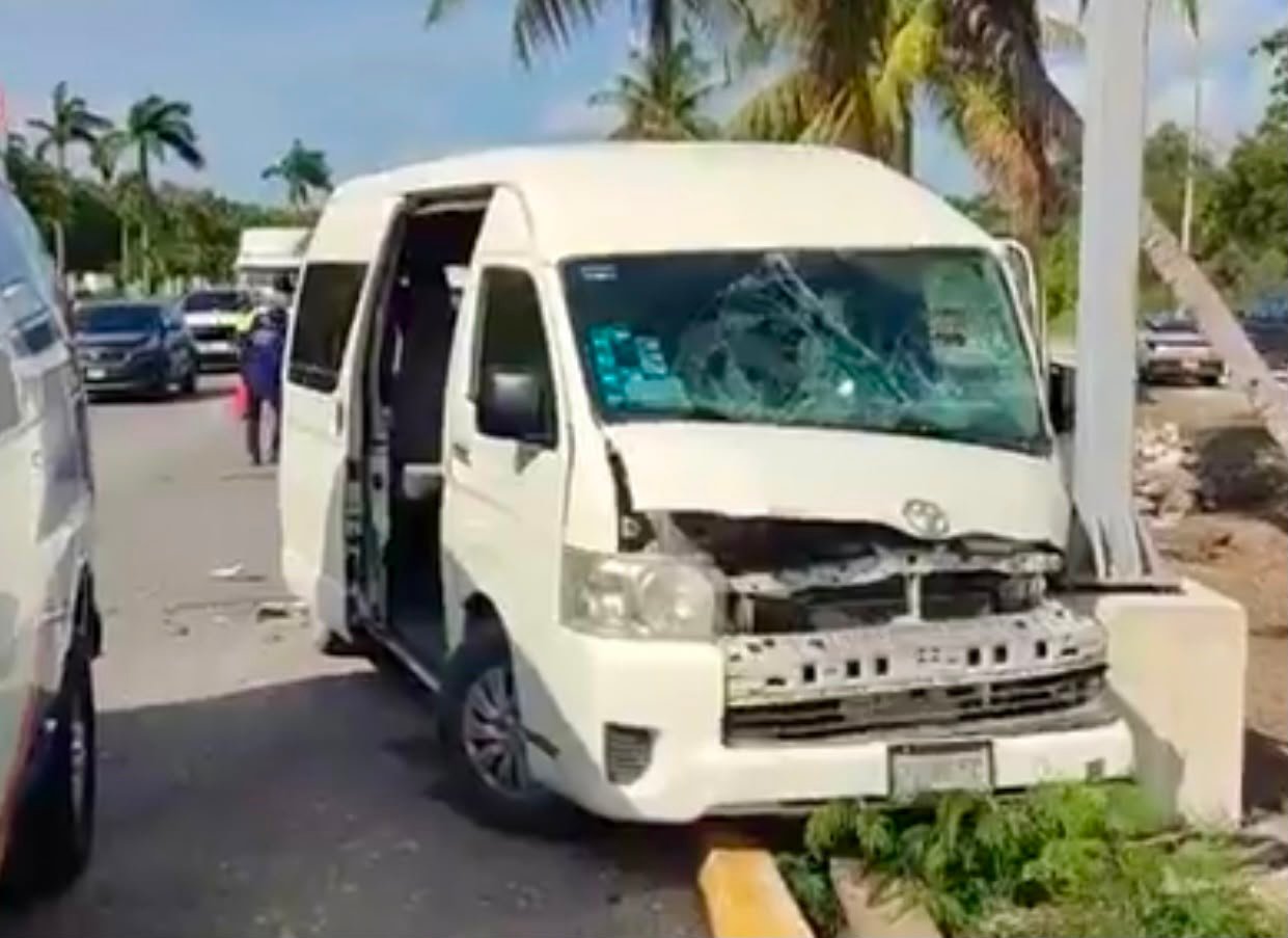 Emergency responders at the scene of a crash between a tourist van and a pickup truck on Bulevar Playa del Carmen