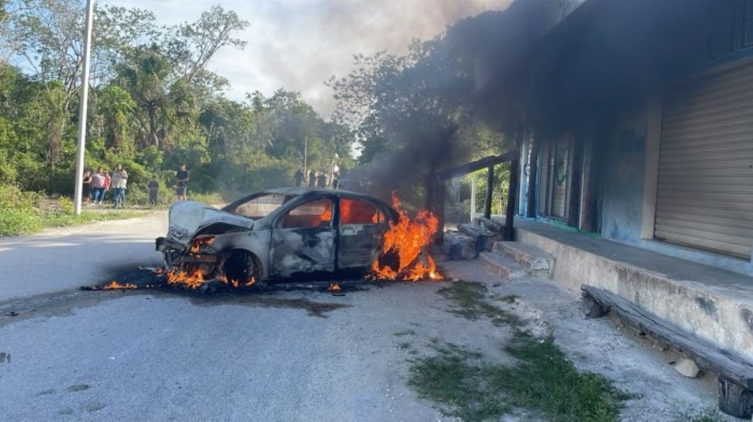 Emergency responders at the scene of a head-on collision between a Volkswagen Golf and a Nissan Urvan van in Playa del Carmen