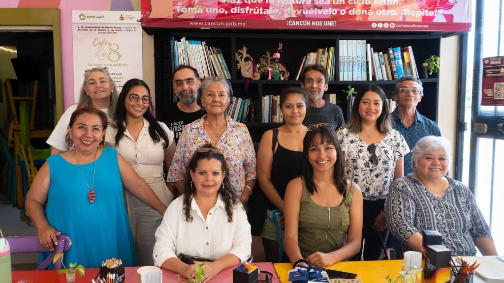 People writing in notebooks at a creative writing workshop in Cancún