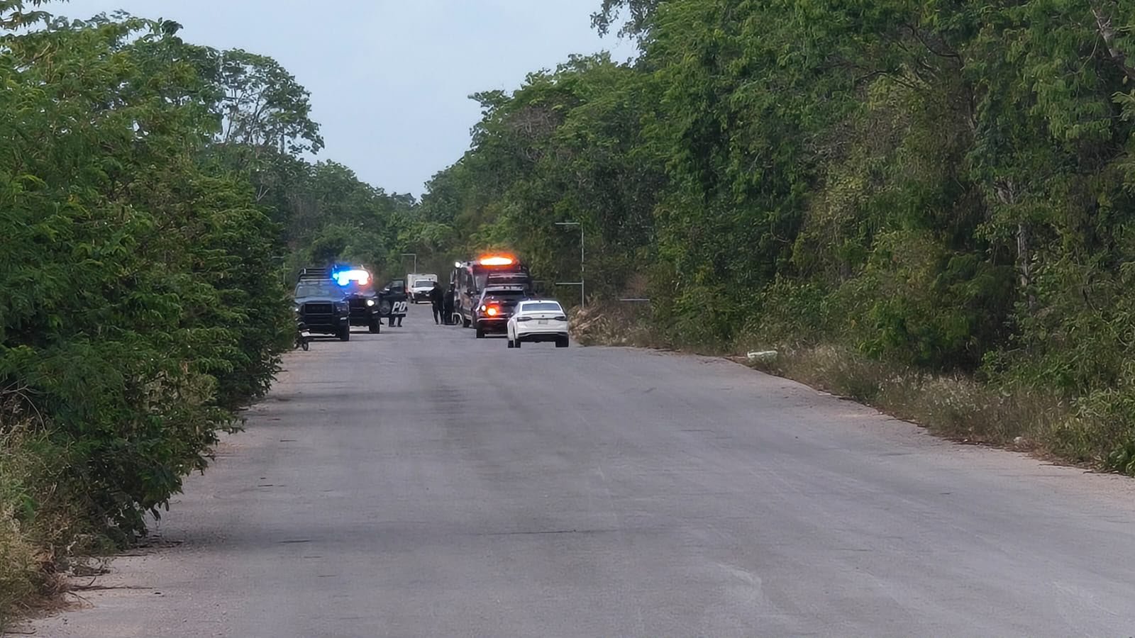 Police officers at a construction site in Playa del Carmen after a shooting