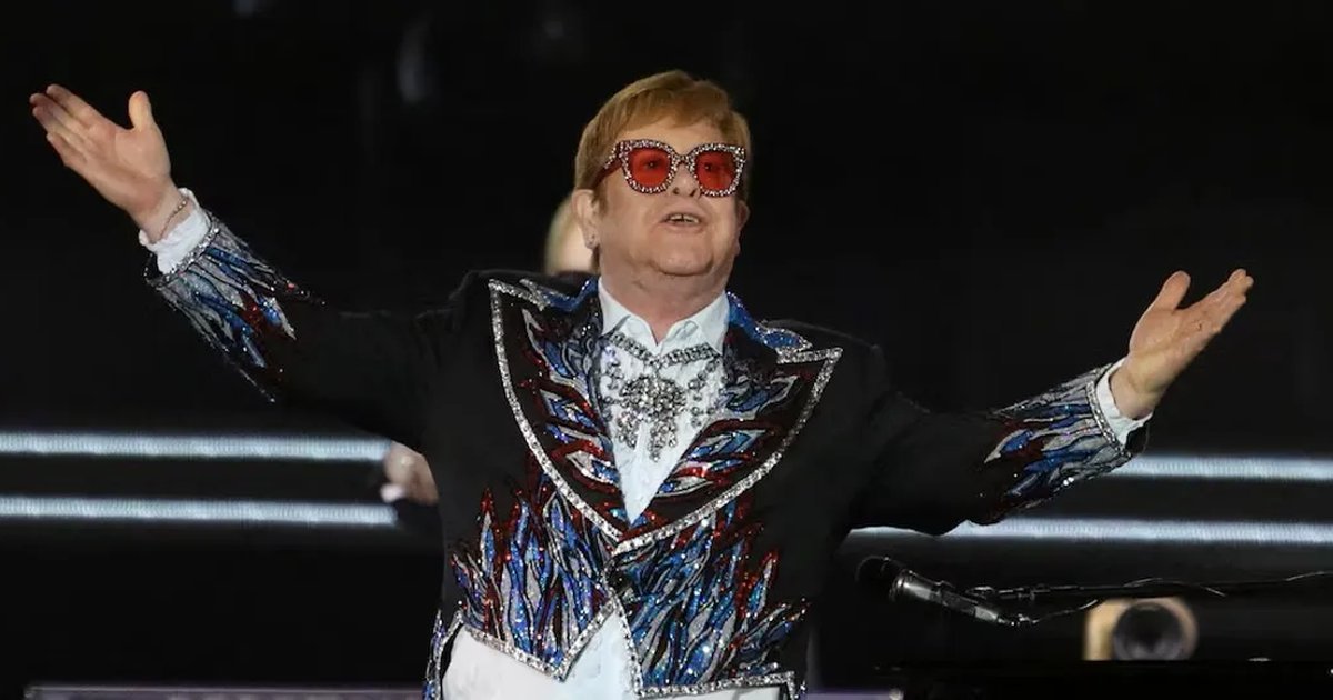 Elton John performing on stage during a concert