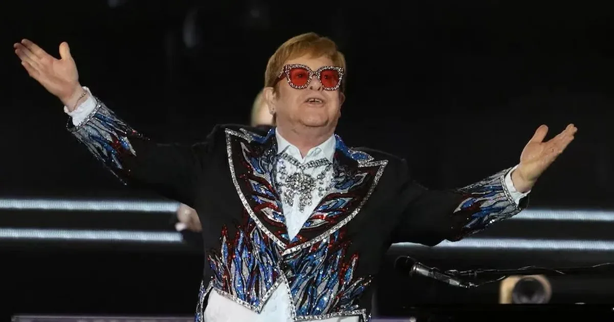 Elton John performing on stage during a concert