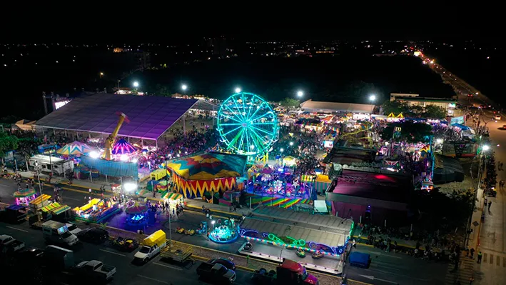 Crowd at the Feria del Carmen in Playa del Carmen with stage and lights