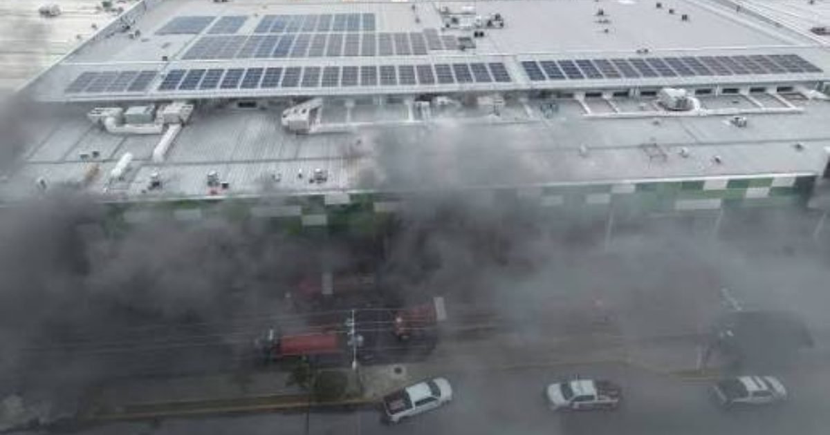 Firefighters and emergency personnel outside the SAT building in Cancun after a fire broke out on the third floor.