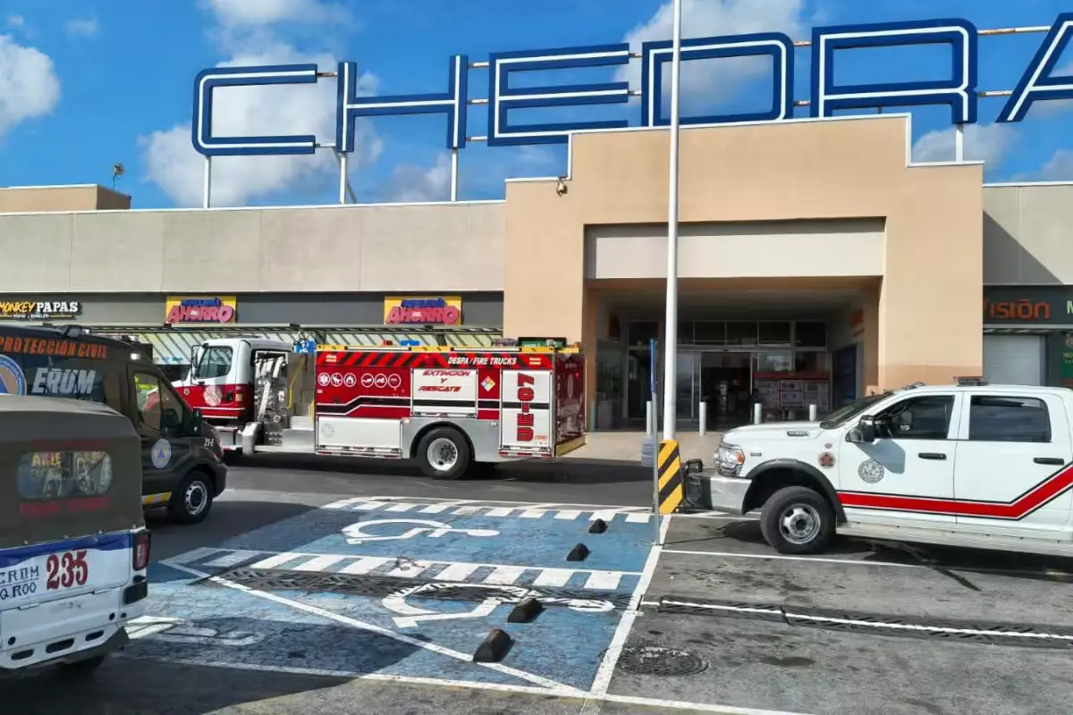 Firefighters inspecting a Chedraui store in Playa del Carmen after smoke reports