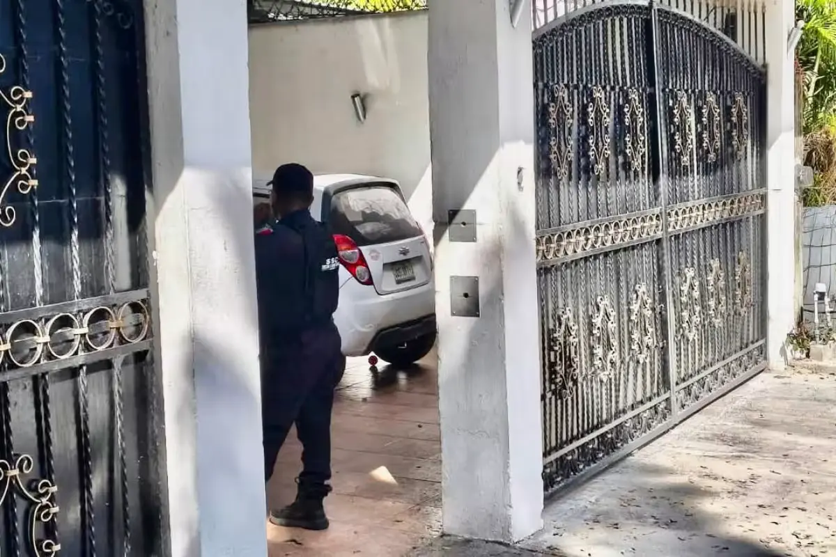 Forensic investigators from the Quintana Roo Prosecutor's Office work at a house used as a suspected rehab center in Playa del Carmen.