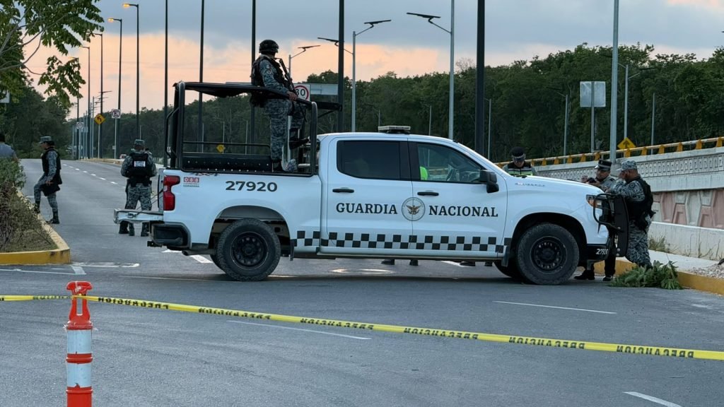 Police and emergency vehicles at the scene of a fatal hit-and-run on Highway 180-D in Cancun