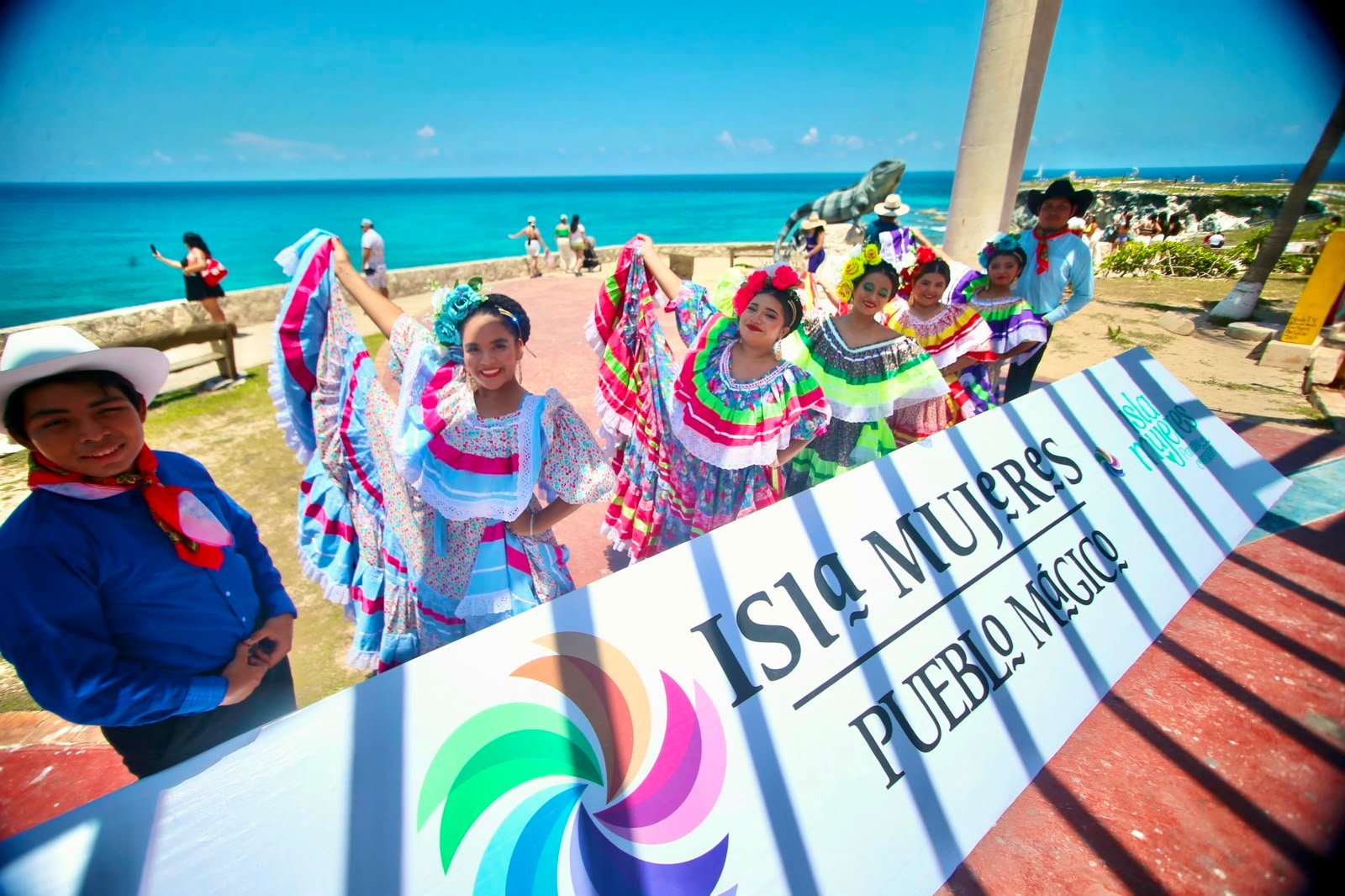 Performers in colorful traditional costumes dance at Punta Sur in Isla Mujeres during the Magia en Punta Sur event.