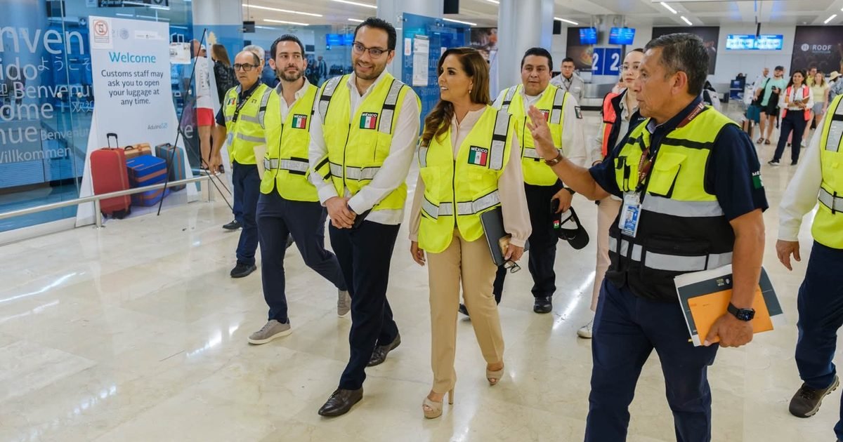 Governor Mara Lezama and National Customs Agency officials walk through the baggage claim area at Cancun International Airport