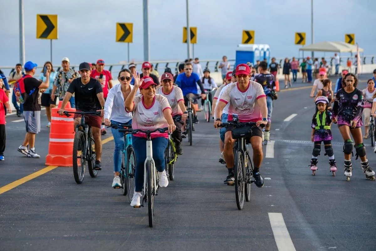Governor Mara Lezama rides a bicycle on the Nichupté Bridge during the first PuenteyAndo event in Cancún, Quintana Roo.