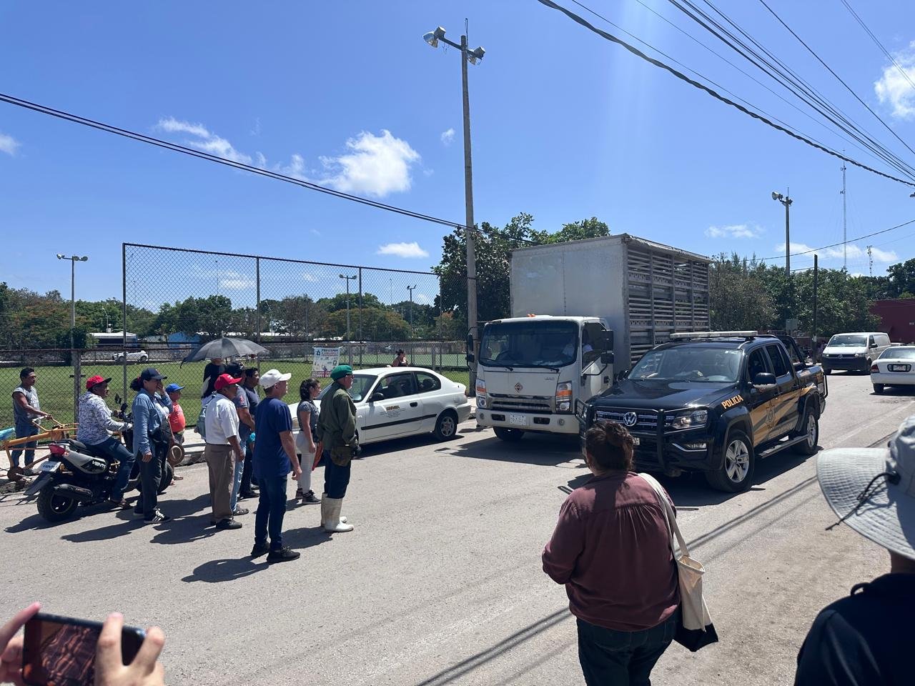 Residents of the Maya community Molas holding signs during a protest against pig farms and real estate projects in Yucatan, Mexico.
