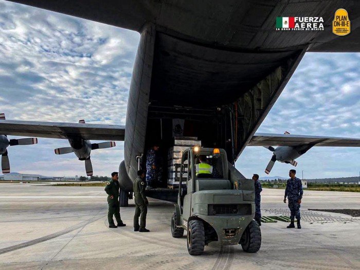 A Mexican Air Force aircraft parked at Cozumel International Airport, loaded with humanitarian supplies for Venezuela.