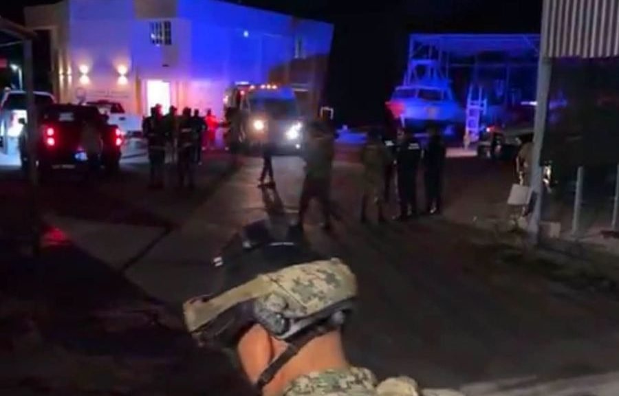 Mexican Navy personnel rescuing people from a sinking boat in Chetumal Bay