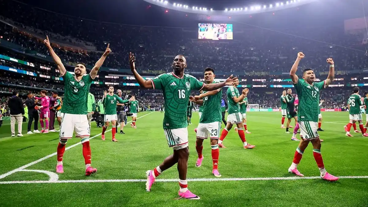Soccer fans in stadium with Mexico and England flags