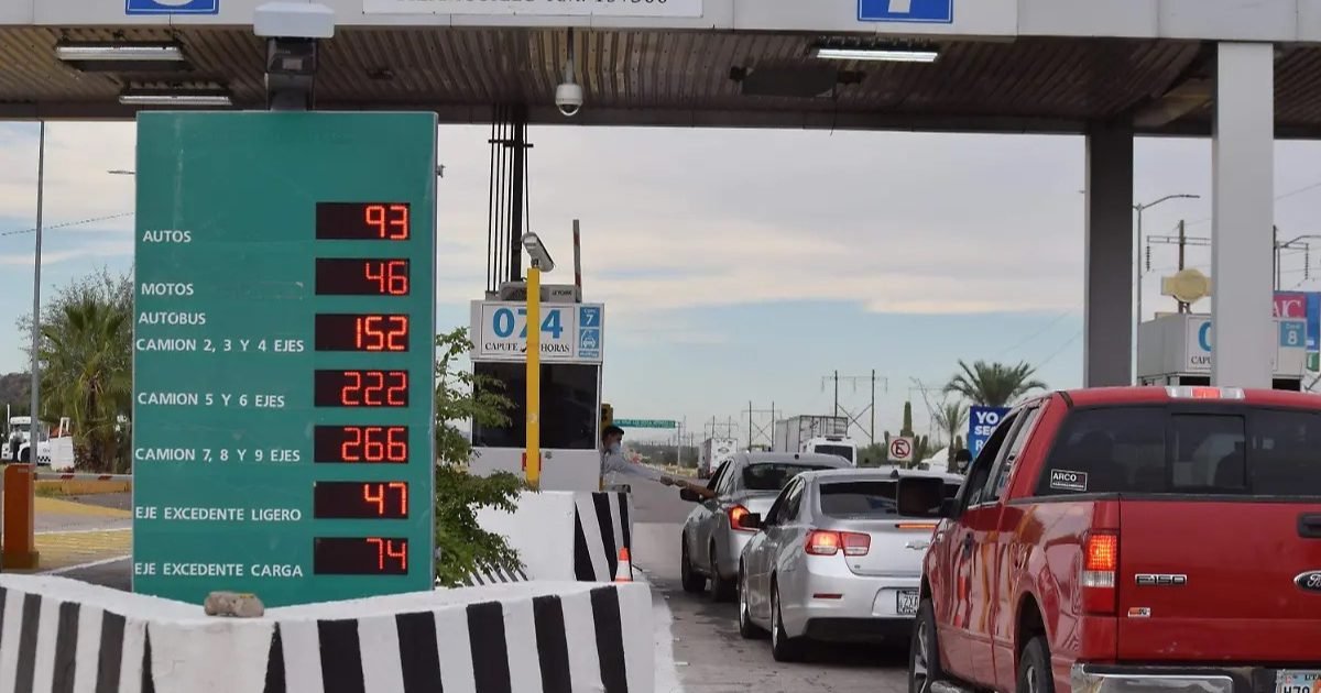 A toll booth on a Mexican highway with electronic payment signage