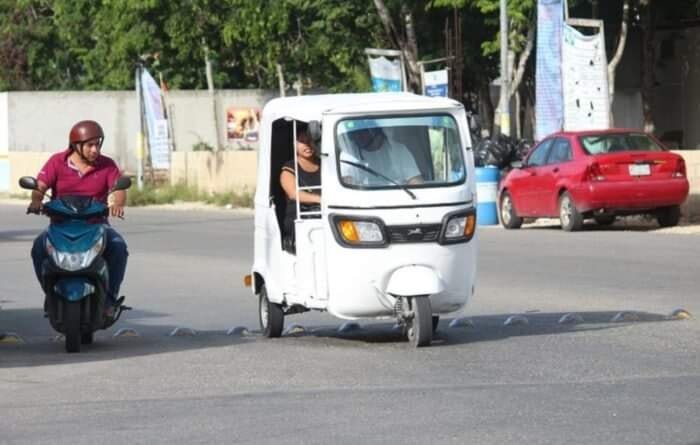 A row of mototaxis parked on a street in Playa del Carmen, Quintana Roo