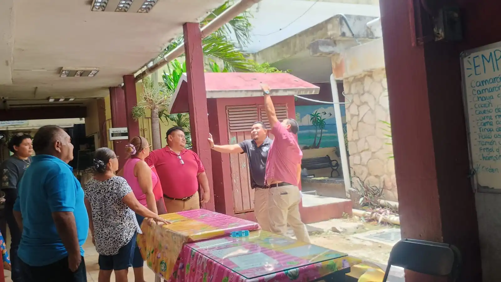 Municipal officials inspecting damaged roofs and structures at Benito Juarez Market in Cozumel