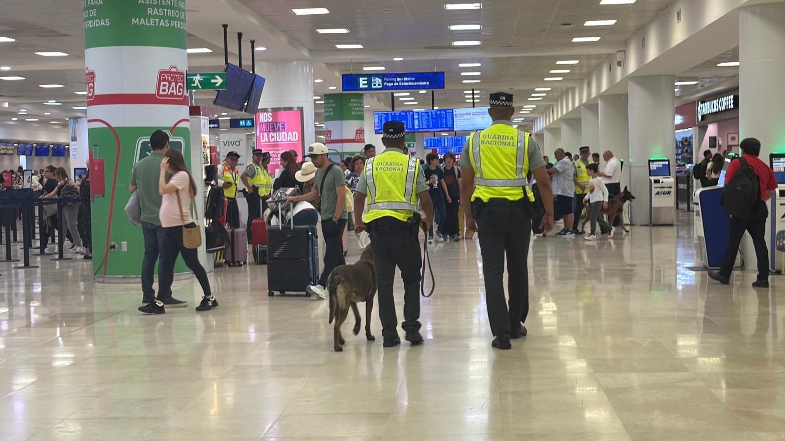 National Guard officers with seized packages of suspected cocaine at Cancun International Airport