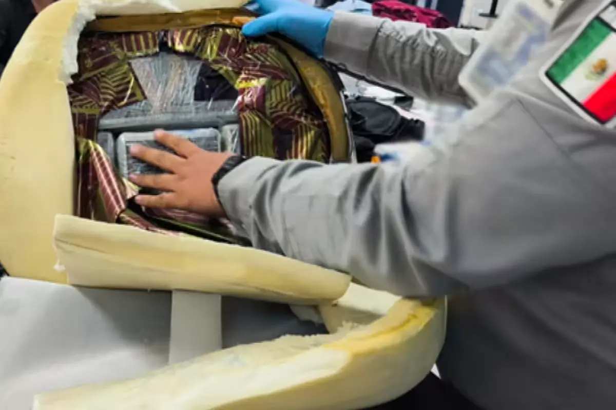 National Guard officers inspecting a wheelchair with hidden cocaine at Cancun International Airport