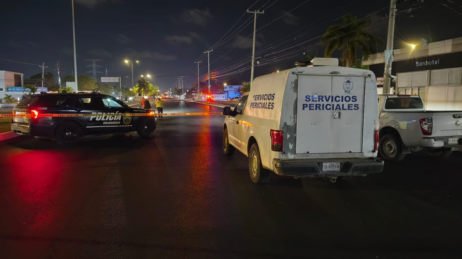 Police tape cordoning off the accident site on a Playa del Carmen boulevard