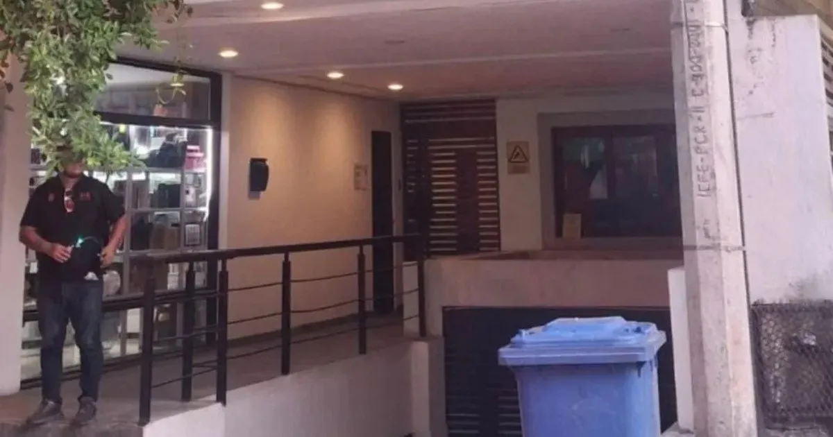 Police officers detaining a man on a street in Playa del Carmen