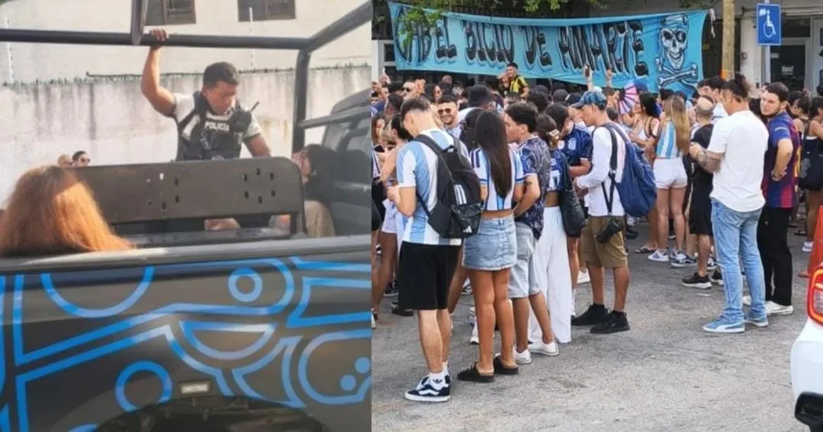 Police officers detain several people on a street in Playa del Carmen after a fight following the 2026 World Cup final.