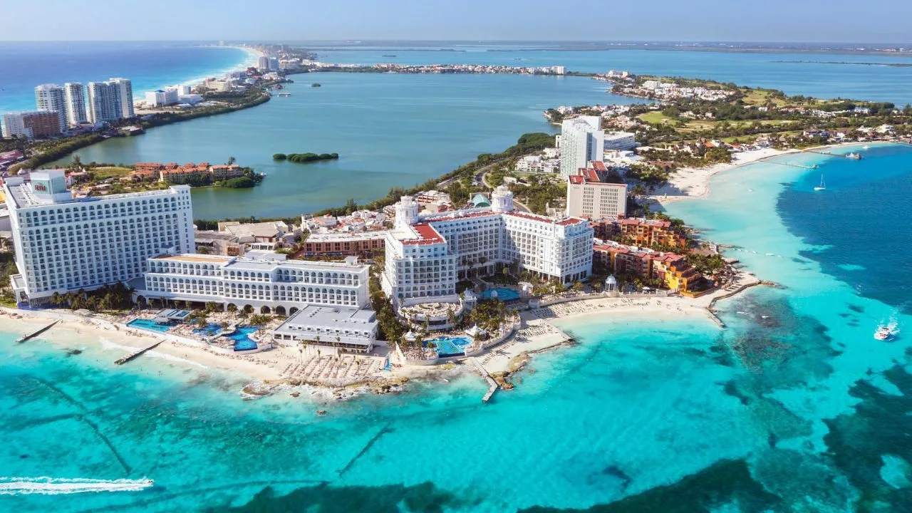Aerial view of Nichupté Lagoon in Cancun showing signs of pollution and urban development along the shoreline.