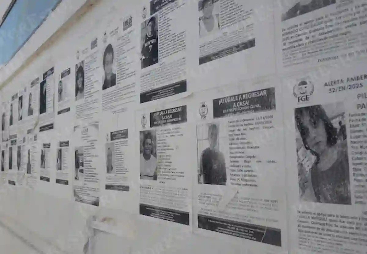 Family members at a government office in Quintana Roo, reviewing documents related to missing persons identification