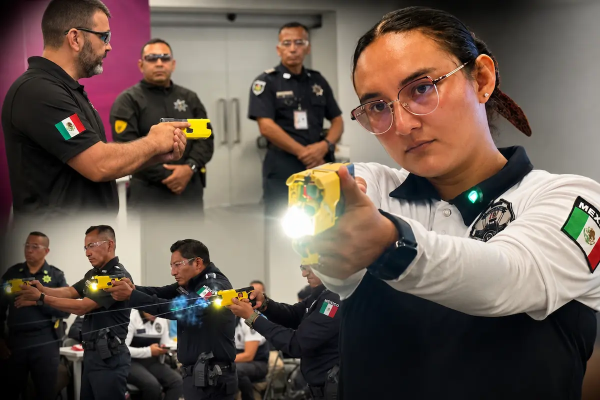 Police officer holding a Taser device in Quintana Roo