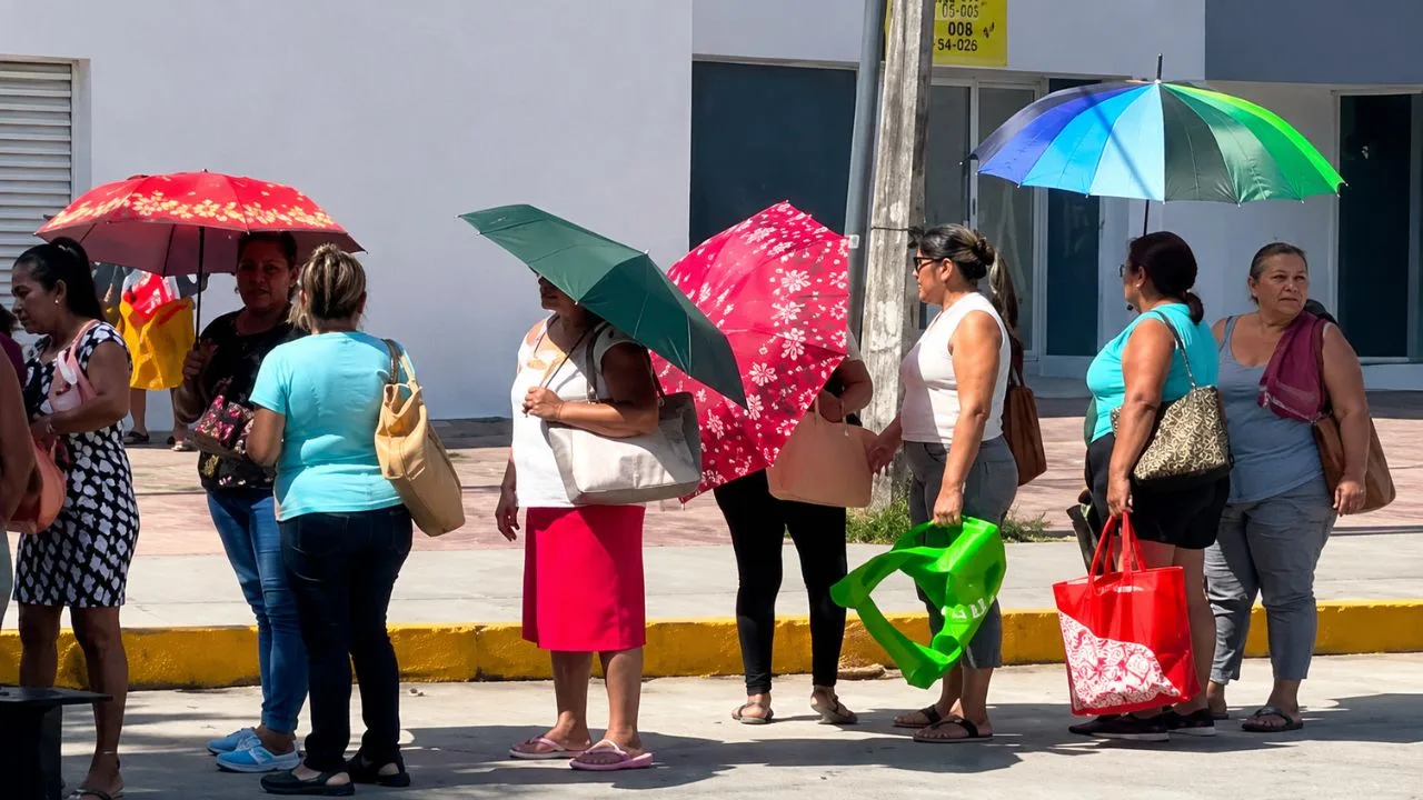 Red Cross paramedics treat a person suffering from heat exhaustion in Cancun